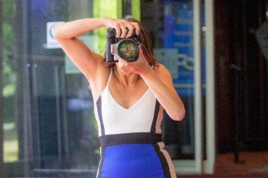Mandi, wedding photographer at Confetti Chasers specialising in candid moments